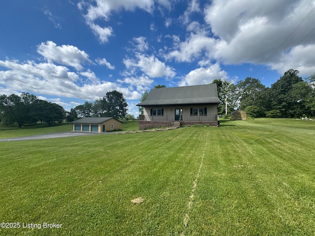 45 Paula Ct, Ekron, KY 40117 - bungalow-style house featuring a porch, an outdoor structure, a front yard, and a detached garage