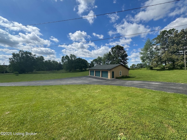 45 Paula Ct, Ekron, KY 40117 - view of front of home featuring an outdoor structure, a detached garage, and a front yard