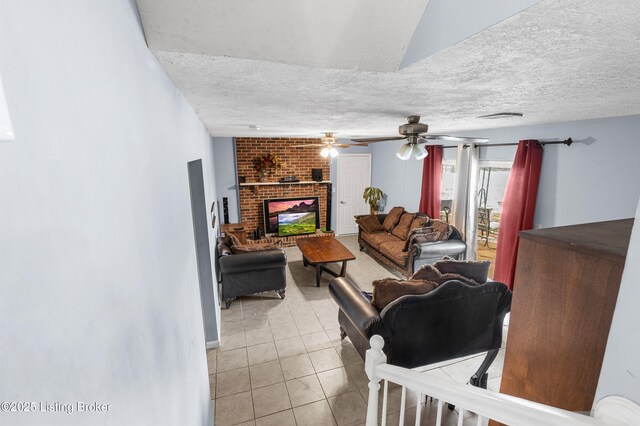 533 Wyandot Ct, Radcliff, KY 40160 - living area with a textured ceiling, a fireplace, light tile patterned flooring, and a ceiling fan