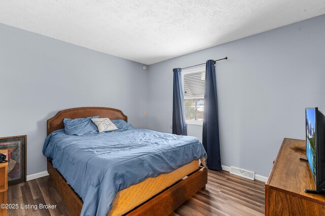 533 Wyandot Ct, Radcliff, KY 40160 - bedroom with wood finished floors, baseboards, and a textured ceiling