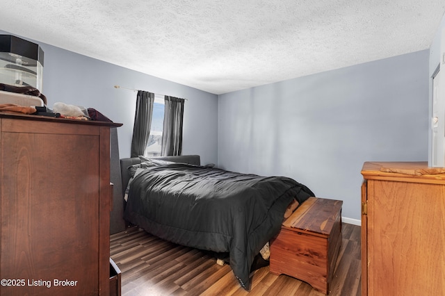 533 Wyandot Ct, Radcliff, KY 40160 - bedroom featuring wood finished floors, a textured ceiling, and baseboards
