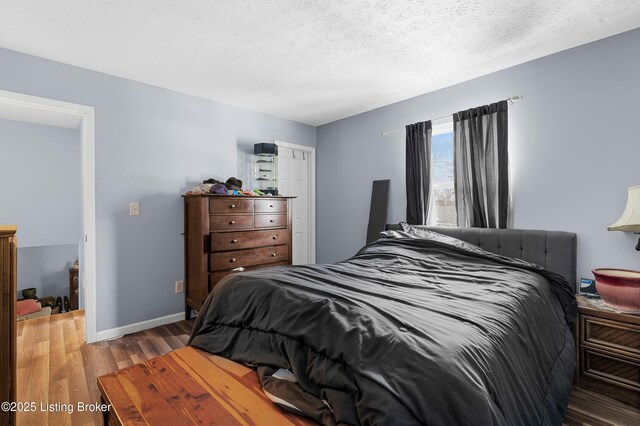 533 Wyandot Ct, Radcliff, KY 40160 - bedroom featuring wood finished floors, baseboards, and a textured ceiling