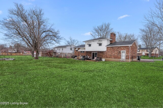 533 Wyandot Ct, Radcliff, KY 40160 - back of property with a chimney and brick siding