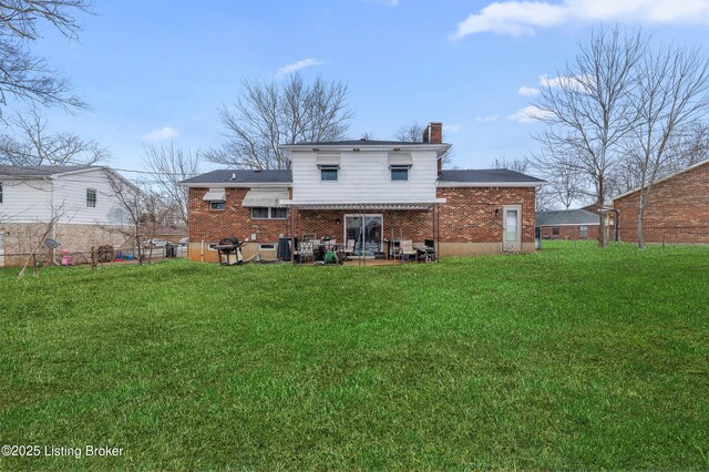 533 Wyandot Ct, Radcliff, KY 40160 - rear view of property featuring brick siding, a chimney, and a patio area