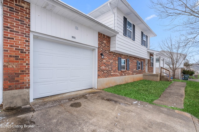 533 Wyandot Ct, Radcliff, KY 40160 - view of side of home with brick siding, concrete driveway, and a garage
