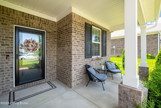 5806 Kellie Woods Dr, Louisville, KY 40258 - view of exterior entry with a porch and brick siding