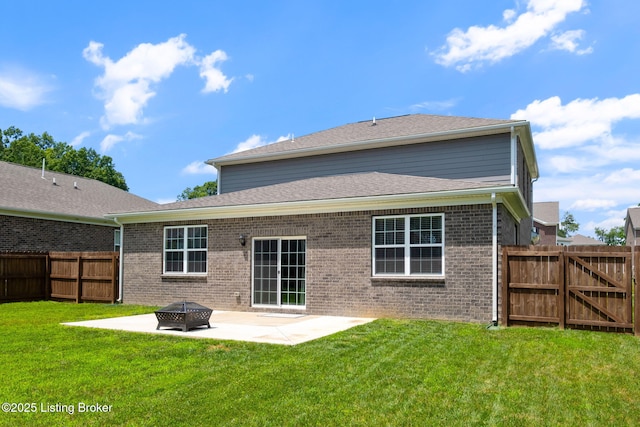 5806 Kellie Woods Dr, Louisville, KY 40258 - back of property featuring a patio, a fenced backyard, brick siding, and a fire pit