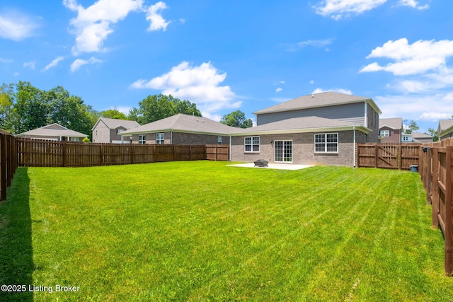 5806 Kellie Woods Dr, Louisville, KY 40258 - back of house with a fenced backyard, a patio area, and brick siding