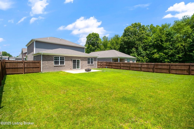 5806 Kellie Woods Dr, Louisville, KY 40258 - rear view of house featuring a patio, a fenced backyard, and brick siding