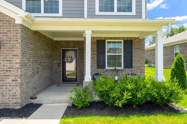 5806 Kellie Woods Dr, Louisville, KY 40258 - property entrance with a porch and brick siding