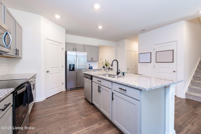 5806 Kellie Woods Dr, Louisville, KY 40258 - kitchen featuring stainless steel appliances, gray cabinets, dark wood-style flooring, light stone countertops, and recessed lighting