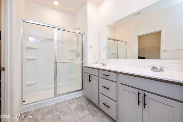 5806 Kellie Woods Dr, Louisville, KY 40258 - bathroom featuring a stall shower, double vanity, and a walk in closet