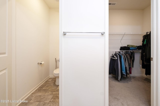 5806 Kellie Woods Dr, Louisville, KY 40258 - bathroom featuring toilet and a walk in closet