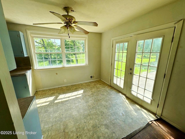 515 Gumwell Rd, Brandenburg, KY 40108 - unfurnished dining area with ceiling fan, french doors, and baseboards