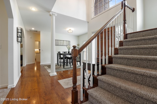 13512 Springs Station Rd, Louisville, KY 40245 - stairs with wood finished floors, ornate columns, baseboards, and recessed lighting