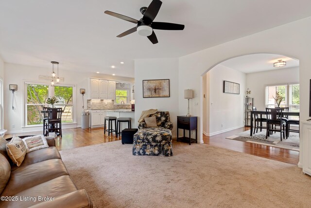 13512 Springs Station Rd, Louisville, KY 40245 - living room with arched walkways, ceiling fan, carpet, wood finished floors, and recessed lighting