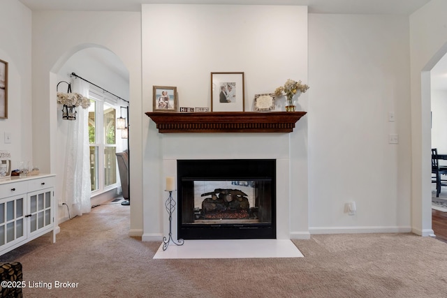 13512 Springs Station Rd, Louisville, KY 40245 - living room featuring carpet flooring, a multi sided fireplace, baseboards, and arched walkways