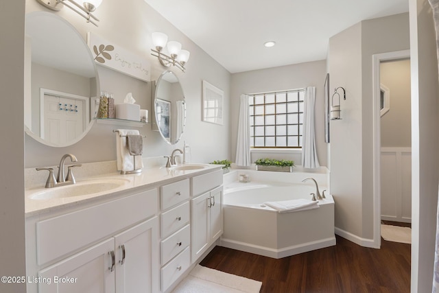 13512 Springs Station Rd, Louisville, KY 40245 - full bath with wood finished floors, double vanity, a garden tub, and recessed lighting