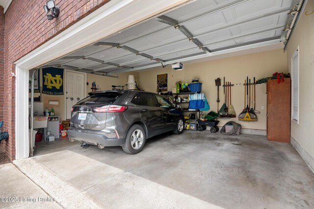 13512 Springs Station Rd, Louisville, KY 40245 - garage with a garage door opener