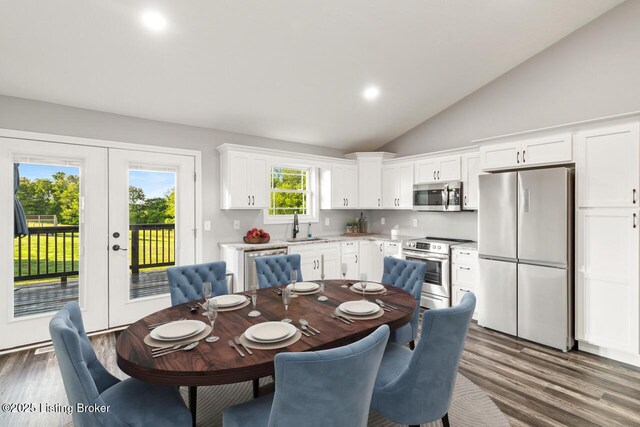760 Leafdale Rd, Hodgenville, KY 42748 - dining area with wood finished floors, french doors, recessed lighting, and high vaulted ceiling