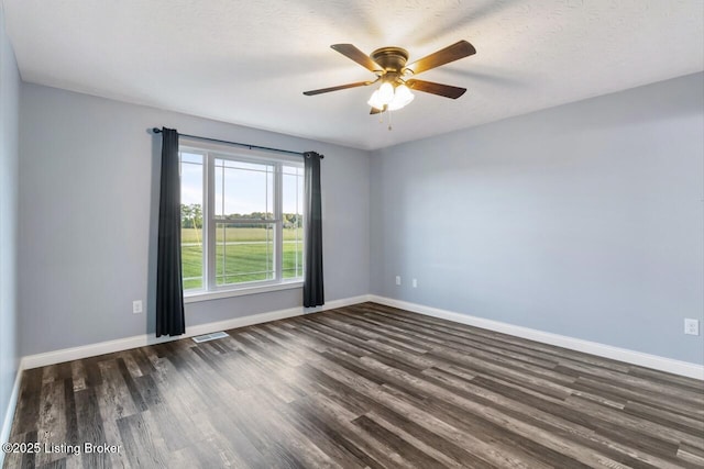 760 Leafdale Rd, Hodgenville, KY 42748 - unfurnished room featuring dark wood-type flooring, baseboards, and a ceiling fan