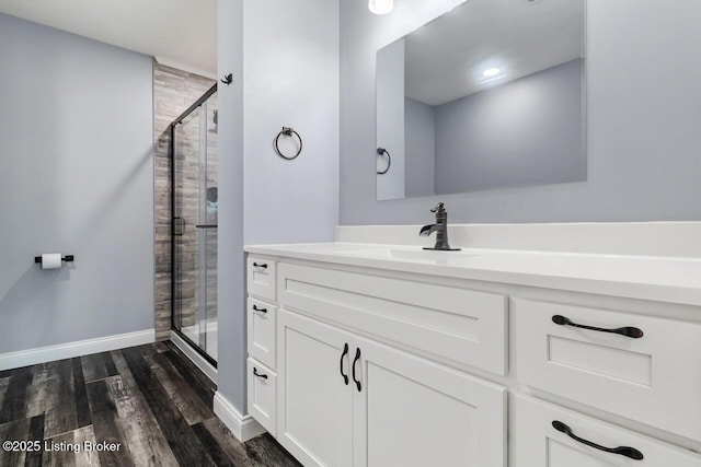 760 Leafdale Rd, Hodgenville, KY 42748 - bathroom with a shower stall, vanity, wood finished floors, and baseboards