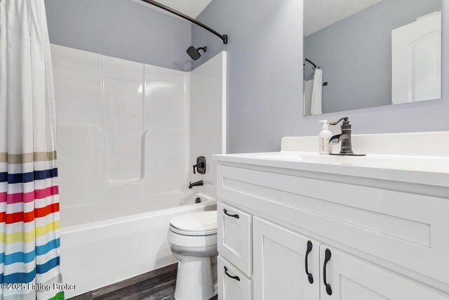 760 Leafdale Rd, Hodgenville, KY 42748 - bathroom with vanity, shower / bath combination with curtain, toilet, and wood finished floors