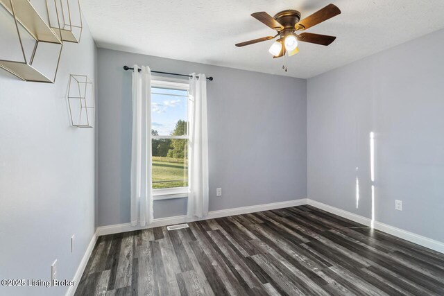 760 Leafdale Rd, Hodgenville, KY 42748 - spare room featuring dark wood-style flooring, ceiling fan, and baseboards