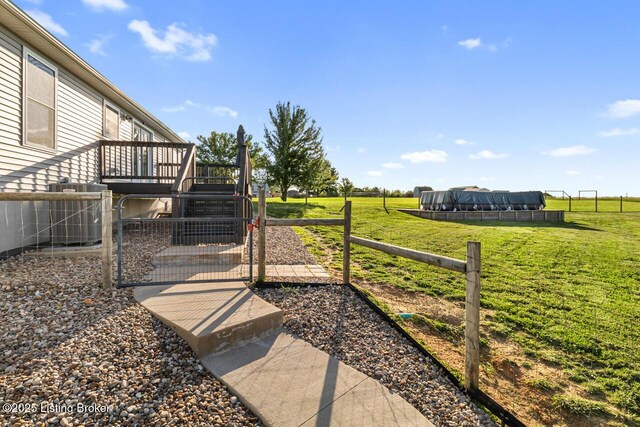 760 Leafdale Rd, Hodgenville, KY 42748 - view of yard with a gate, central air condition unit, a wooden deck, and a rural view