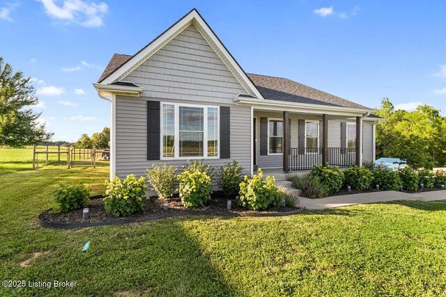 760 Leafdale Rd, Hodgenville, KY 42748 - view of front of property with covered porch, a front yard, and a shingled roof