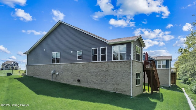 816 Snead Ct, Simpsonville, KY 40067 - back of house featuring brick siding, a lawn, a deck, and stairway