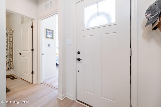 816 Snead Ct, Simpsonville, KY 40067 - foyer with light wood finished floors and baseboards