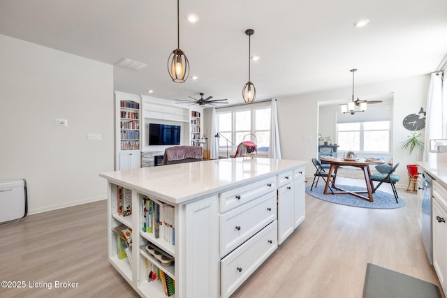 816 Snead Ct, Simpsonville, KY 40067 - kitchen with light wood-type flooring, ceiling fan, open shelves, white cabinetry, and healthy amount of natural light