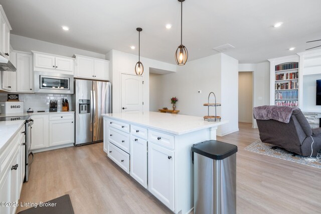 816 Snead Ct, Simpsonville, KY 40067 - kitchen with appliances with stainless steel finishes, open floor plan, light wood-type flooring, white cabinets, and recessed lighting