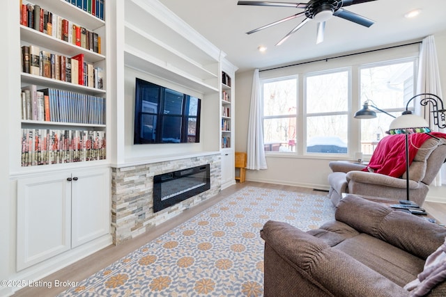 816 Snead Ct, Simpsonville, KY 40067 - living area with wood finished floors, a ceiling fan, built in features, recessed lighting, and a stone fireplace