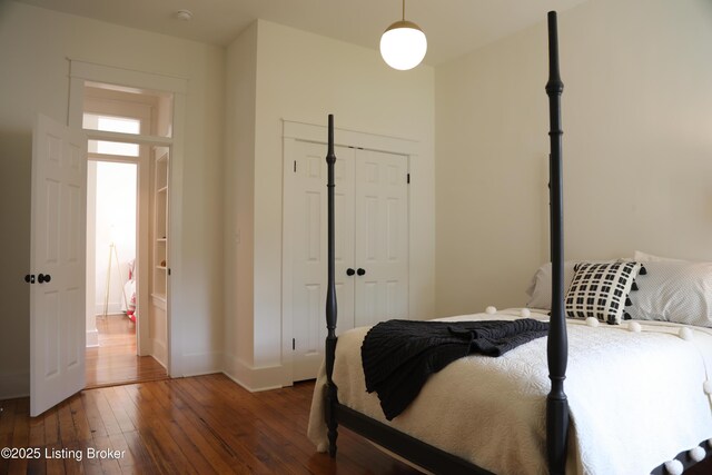 456 E Brandeis Ave, Louisville, KY 40217 - bedroom with hardwood / wood-style flooring, a closet, and baseboards