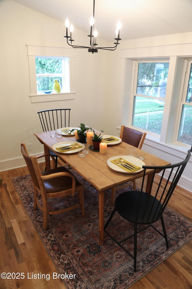 456 E Brandeis Ave, Louisville, KY 40217 - dining space with a chandelier, plenty of natural light, wood finished floors, and lofted ceiling