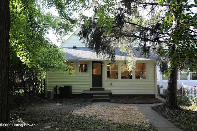 456 E Brandeis Ave, Louisville, KY 40217 - view of front of home with central AC unit and a shingled roof