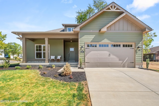 801 Artisan Pkwy, La Grange, KY 40031 - craftsman-style house with a garage, a porch, concrete driveway, and a front yard