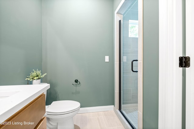 801 Artisan Pkwy, La Grange, KY 40031 - bathroom featuring a shower stall, vanity, baseboards, toilet, and tile patterned flooring