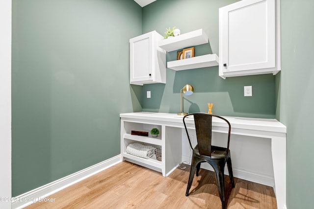 801 Artisan Pkwy, La Grange, KY 40031 - home office with light wood finished floors, baseboards, and built in desk