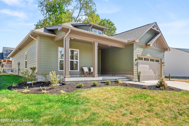 801 Artisan Pkwy, La Grange, KY 40031 - view of front of house with a porch, driveway, a front yard, and a garage