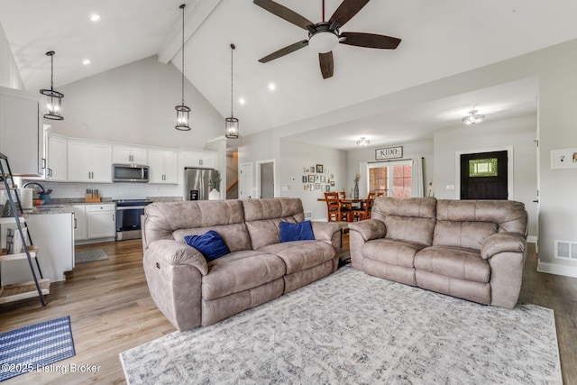 458 Christman Ln, Shepherdsville, KY 40165 - living area with light wood-style flooring, high vaulted ceiling, beam ceiling, a ceiling fan, and baseboards