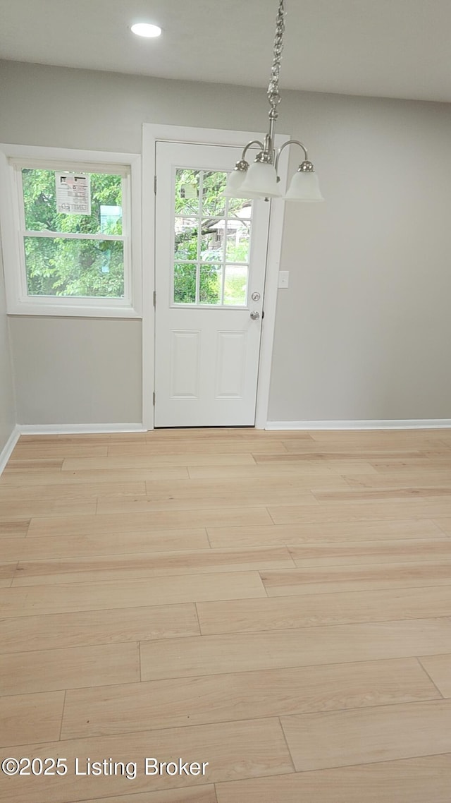 3505 Regatta Way, Louisville, KY 40211 - doorway featuring baseboards, light wood-type flooring, recessed lighting, and a chandelier