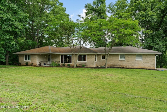 607 Edgemont Rd, Irvington, KY 40146 - back of property with stone siding and a lawn