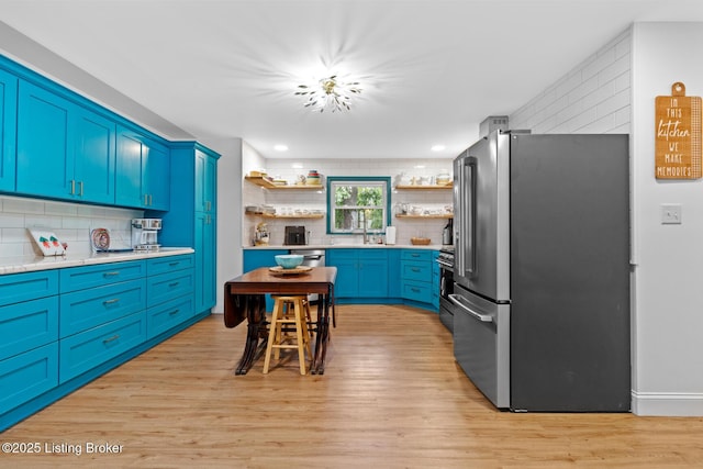 607 Edgemont Rd, Irvington, KY 40146 - kitchen featuring appliances with stainless steel finishes, open shelves, tasteful backsplash, light wood-style flooring, and recessed lighting