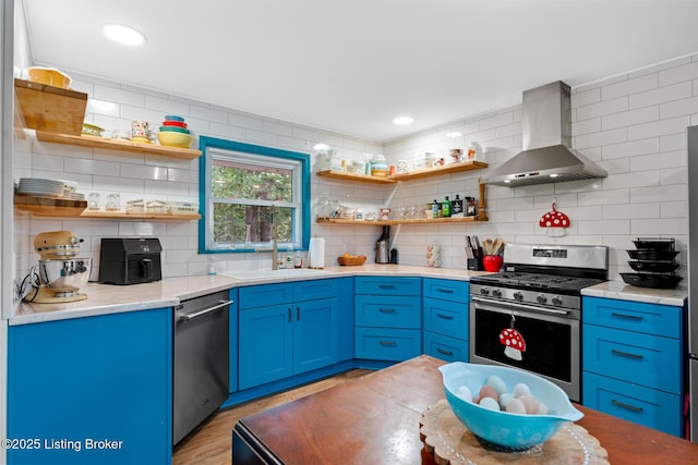 607 Edgemont Rd, Irvington, KY 40146 - kitchen featuring wall chimney range hood, stainless steel appliances, a sink, open shelves, and recessed lighting