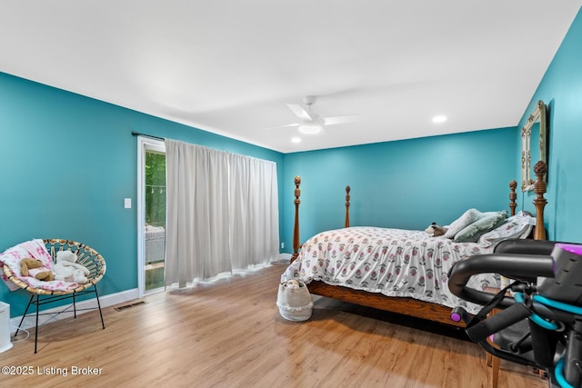 607 Edgemont Rd, Irvington, KY 40146 - bedroom featuring wood finished floors, baseboards, ceiling fan, and access to exterior