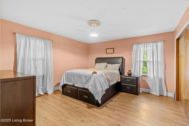 607 Edgemont Rd, Irvington, KY 40146 - bedroom with baseboards, light wood-style floors, a closet, and ceiling fan