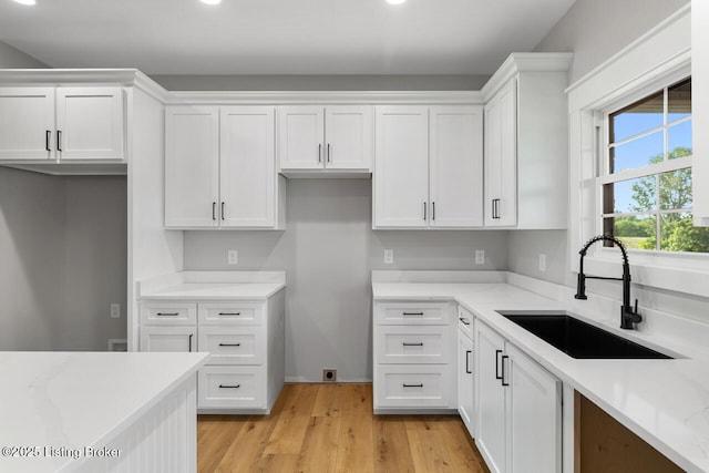 506 Capps Rd, Campbellsville, KY 42718 - kitchen with a sink, white cabinets, light stone countertops, light wood-style floors, and recessed lighting